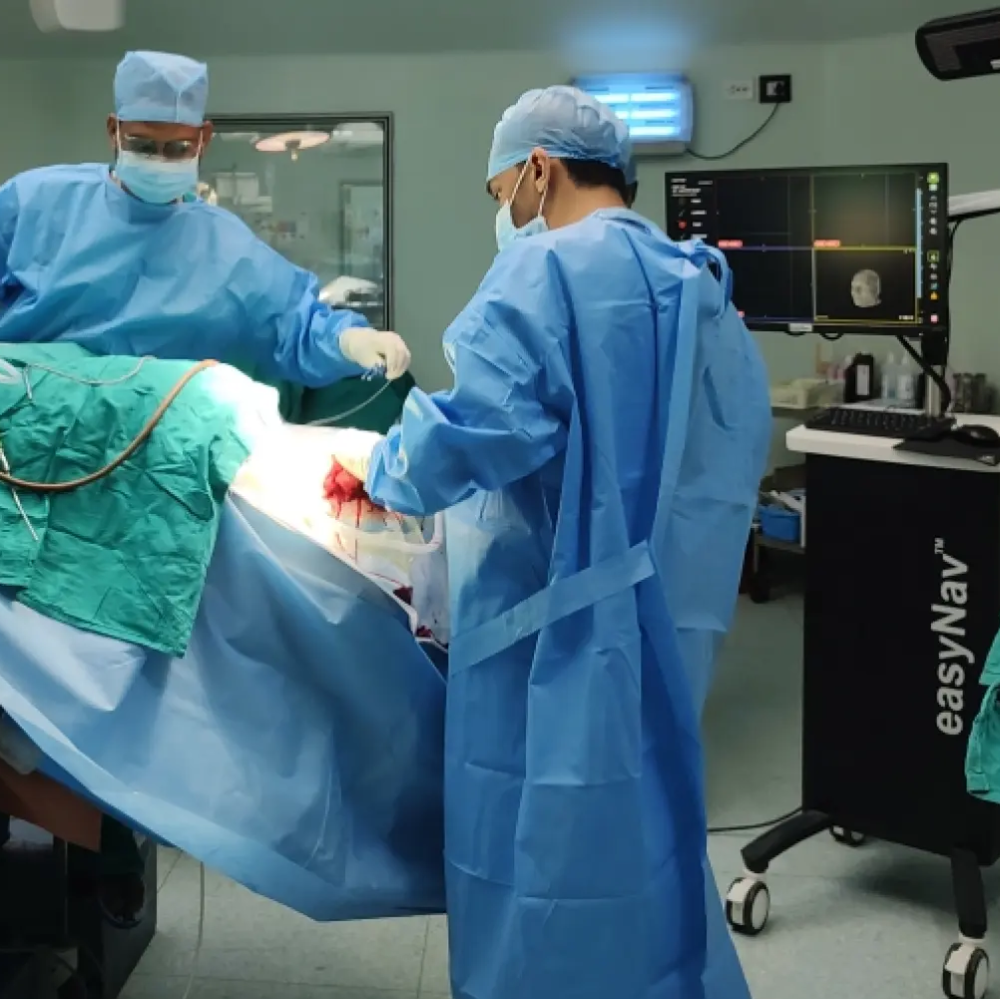 Surgeons performing a procedure using an advanced surgical navigation system for precise image-guided surgery.