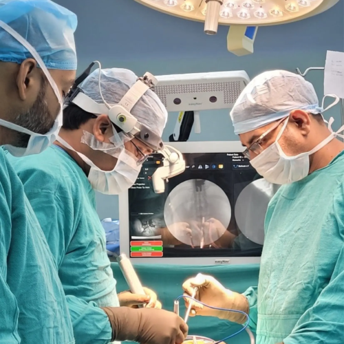 Surgeons using neuronavigation technology for precise image-guided surgery during an operation.